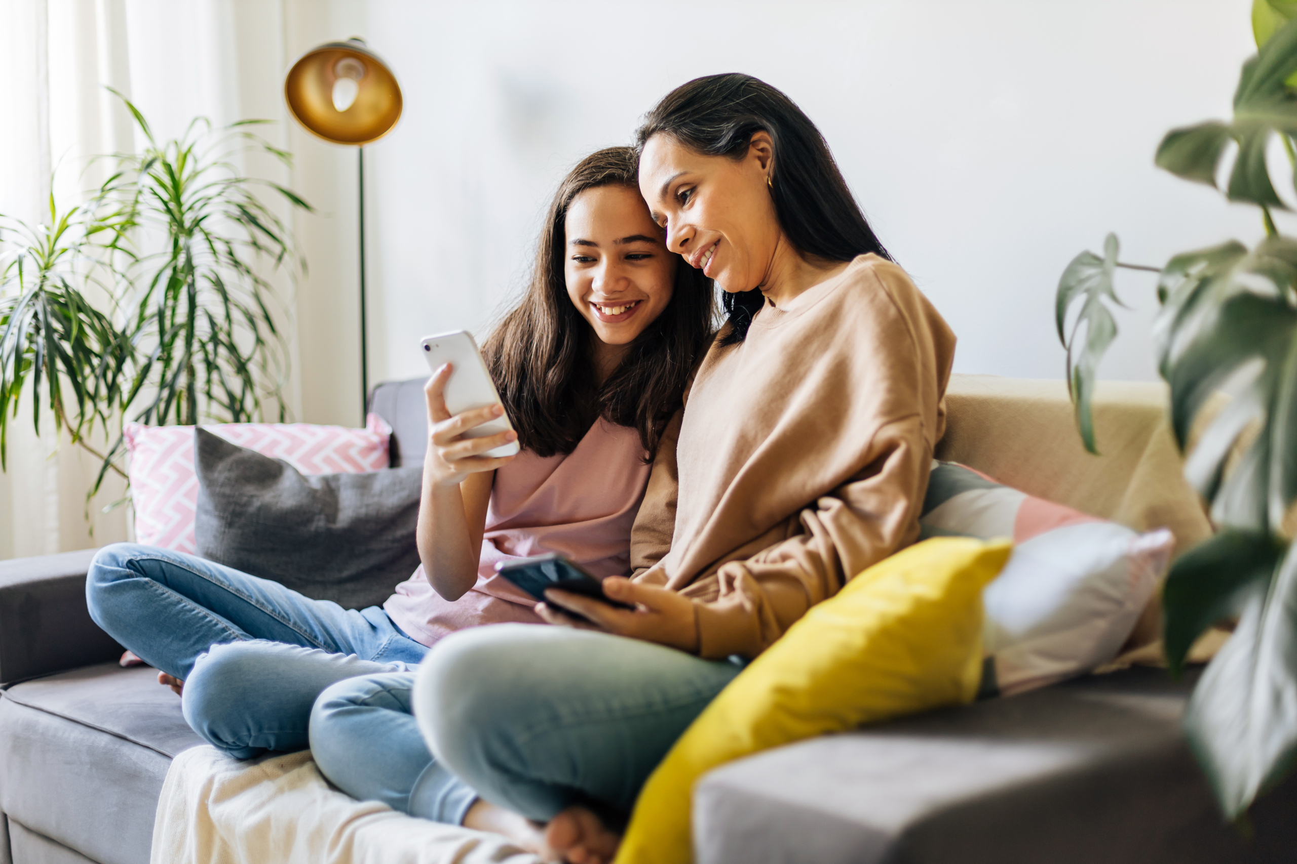 Single parenthood. Mother and daughter spending time together at home.